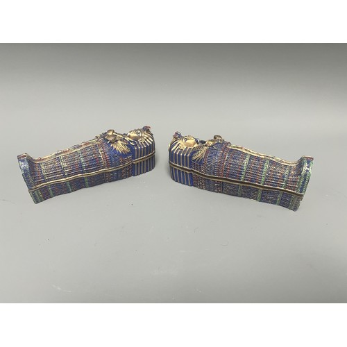 29 - A Pair of Egyptian Revival Painted Resin Anthropoid Sarcophagus Boxes. A pair of modern decorative l... 
