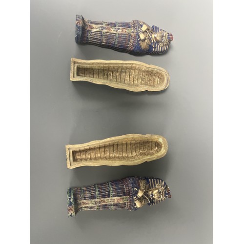 29 - A Pair of Egyptian Revival Painted Resin Anthropoid Sarcophagus Boxes. A pair of modern decorative l... 