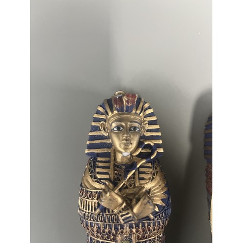 29 - A Pair of Egyptian Revival Painted Resin Anthropoid Sarcophagus Boxes. A pair of modern decorative l... 