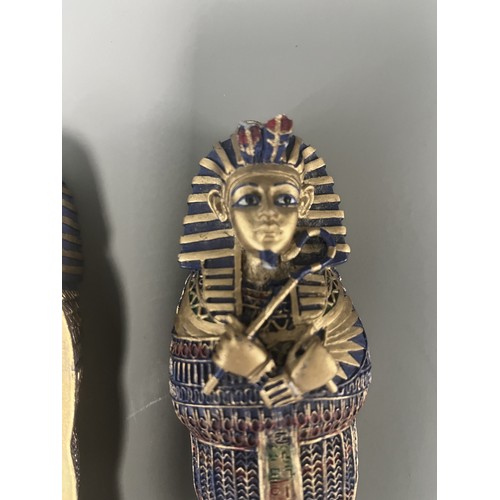 29 - A Pair of Egyptian Revival Painted Resin Anthropoid Sarcophagus Boxes. A pair of modern decorative l... 