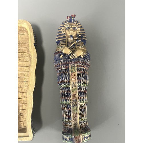 29 - A Pair of Egyptian Revival Painted Resin Anthropoid Sarcophagus Boxes. A pair of modern decorative l... 
