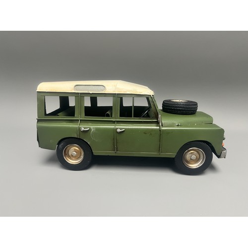 35 - Retro Style Tin Model of a Land Rover 109 Station Wagon. A large decorative model vehicle crafted fr... 