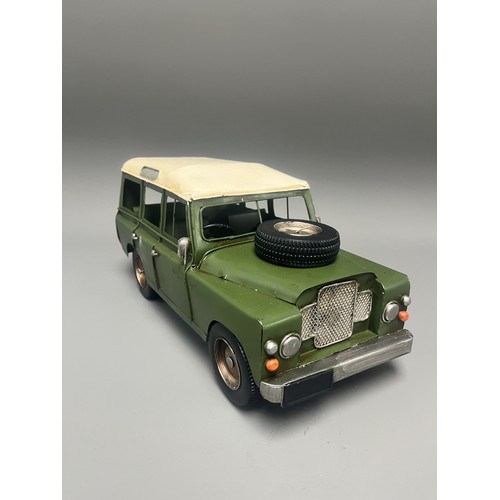 35 - Retro Style Tin Model of a Land Rover 109 Station Wagon. A large decorative model vehicle crafted fr... 