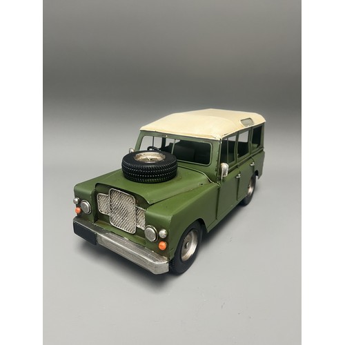 35 - Retro Style Tin Model of a Land Rover 109 Station Wagon. A large decorative model vehicle crafted fr... 