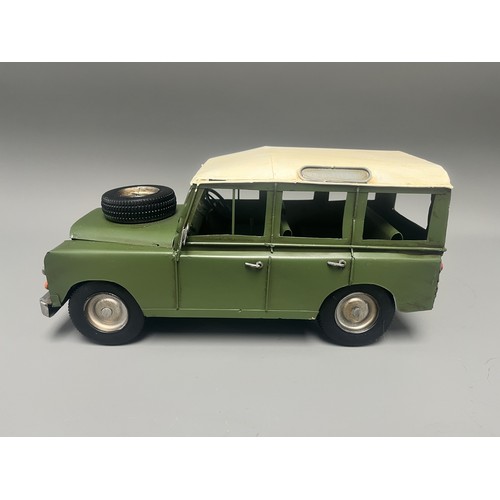 35 - Retro Style Tin Model of a Land Rover 109 Station Wagon. A large decorative model vehicle crafted fr... 