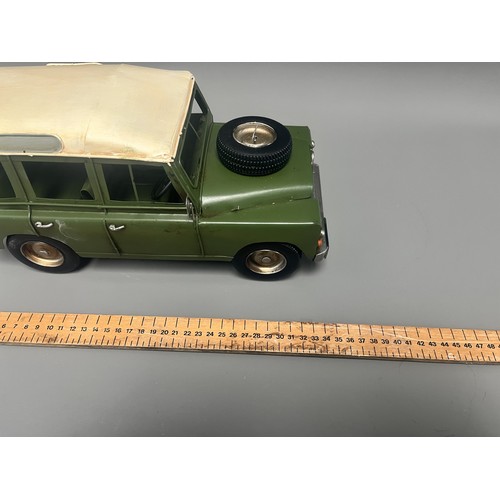 35 - Retro Style Tin Model of a Land Rover 109 Station Wagon. A large decorative model vehicle crafted fr... 