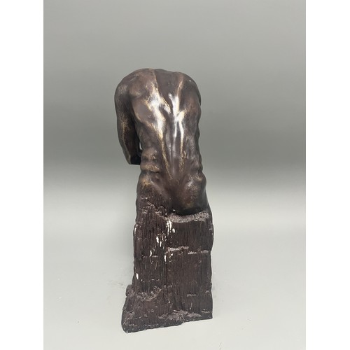 37 - A bronze style resin figure of 'The Thinking Man' by Auguste Rodin. 32 cms tall. Detailed and in goo... 