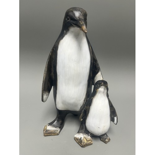 43 - Carved and Painted Wood Sculpture of Two Penguins. A single decorative sculpture, carved from wood, ... 