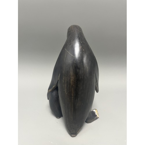 43 - Carved and Painted Wood Sculpture of Two Penguins. A single decorative sculpture, carved from wood, ... 