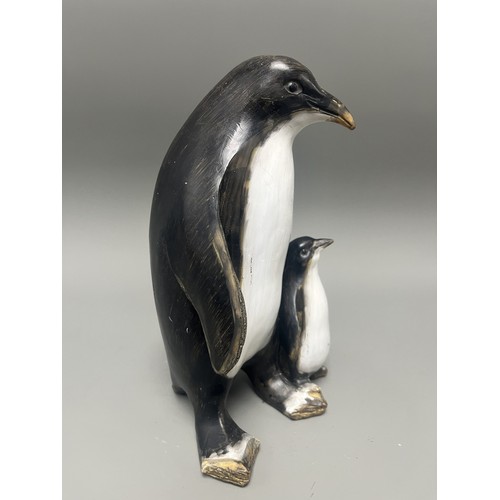43 - Carved and Painted Wood Sculpture of Two Penguins. A single decorative sculpture, carved from wood, ... 