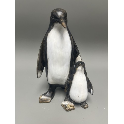43 - Carved and Painted Wood Sculpture of Two Penguins. A single decorative sculpture, carved from wood, ... 