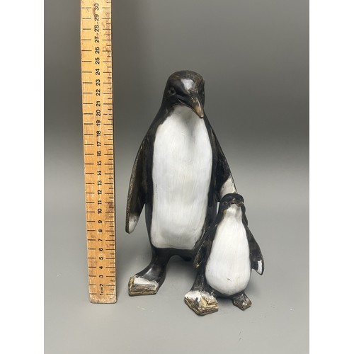 43 - Carved and Painted Wood Sculpture of Two Penguins. A single decorative sculpture, carved from wood, ... 