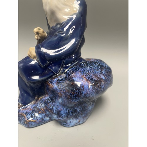 45 - Ceramic Figurine of a Scholar or Immortal with Cobalt and Flambe Glaze. A single ceramic figurine de... 