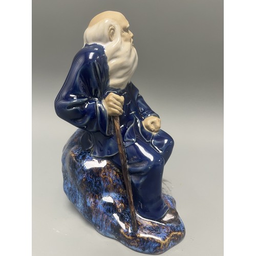 45 - Ceramic Figurine of a Scholar or Immortal with Cobalt and Flambe Glaze. A single ceramic figurine de... 