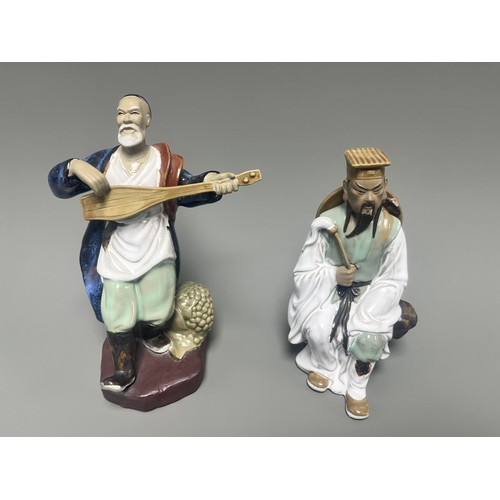 51 - A Pair of Chinese Shiwan Mudman Pottery Figurines, Musician and Scholar. A pair of Chinese Shiwan Mu... 