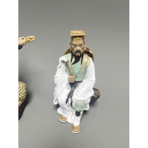 51 - A Pair of Chinese Shiwan Mudman Pottery Figurines, Musician and Scholar. A pair of Chinese Shiwan Mu... 