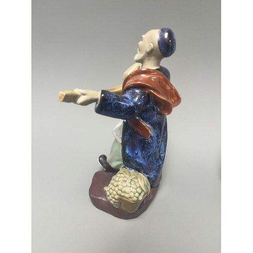 51 - A Pair of Chinese Shiwan Mudman Pottery Figurines, Musician and Scholar. A pair of Chinese Shiwan Mu... 