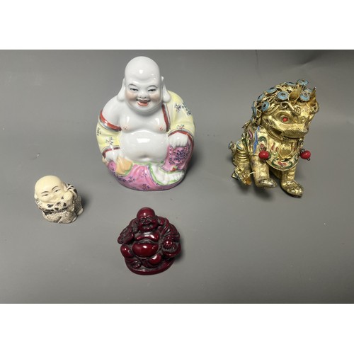15 - Collection of East Asian Figurines including Porcelain Buddha etc. East Asian figurines including a ... 