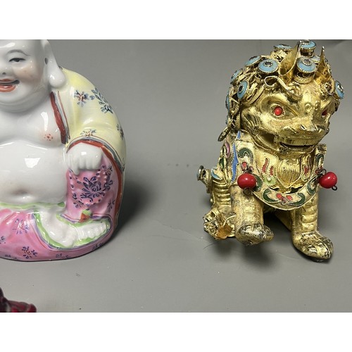 15 - Collection of East Asian Figurines including Porcelain Buddha etc. East Asian figurines including a ... 