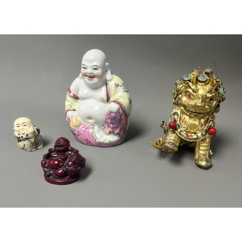 15 - Collection of East Asian Figurines including Porcelain Buddha etc. East Asian figurines including a ... 