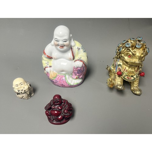 15 - Collection of East Asian Figurines including Porcelain Buddha etc. East Asian figurines including a ... 