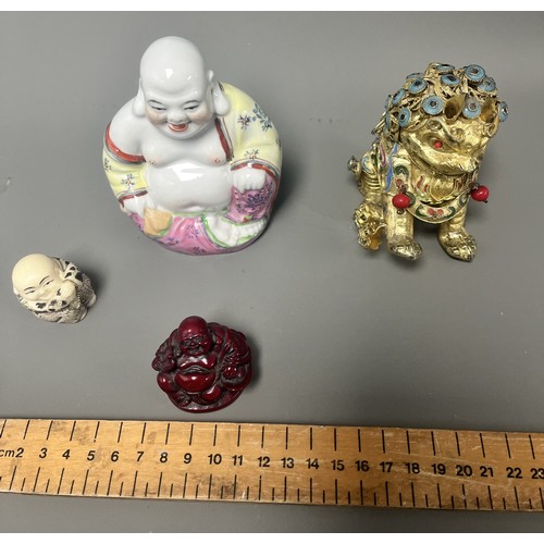 15 - Collection of East Asian Figurines including Porcelain Buddha etc. East Asian figurines including a ... 