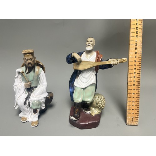 51 - A Pair of Chinese Shiwan Mudman Pottery Figurines, Musician and Scholar. A pair of Chinese Shiwan Mu... 