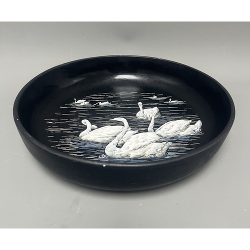 34A - Mintons Black Pottery Bowl with Painted White Swans. A black Mintons pottery bowl featuring a hand-p... 