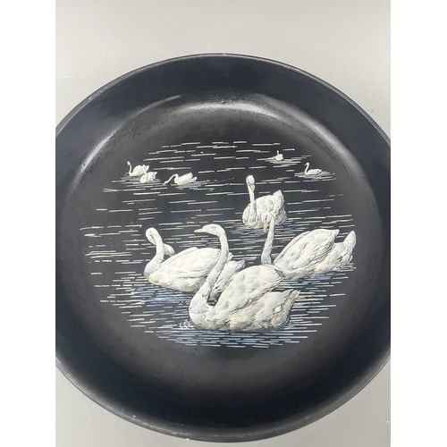 34A - Mintons Black Pottery Bowl with Painted White Swans. A black Mintons pottery bowl featuring a hand-p... 