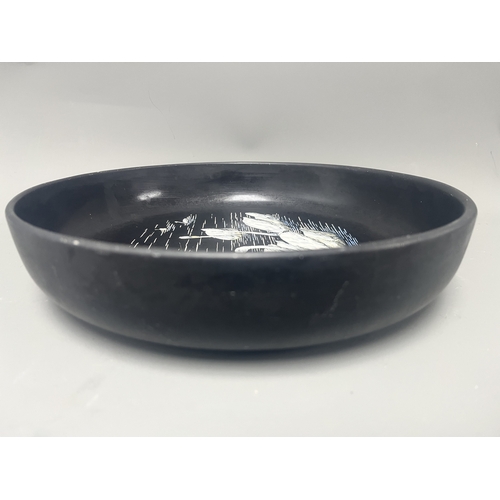 34A - Mintons Black Pottery Bowl with Painted White Swans. A black Mintons pottery bowl featuring a hand-p... 