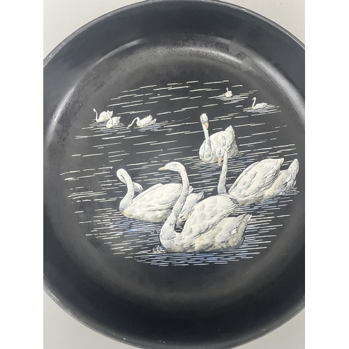 34A - Mintons Black Pottery Bowl with Painted White Swans. A black Mintons pottery bowl featuring a hand-p... 