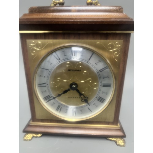 18 - Staiger Wood Cased Quartz Mantel Clock.
A brown wood-cased mantel clock featuring a Staiger quartz m... 
