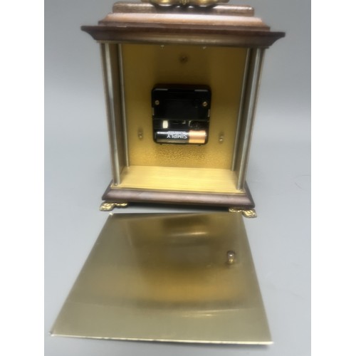 18 - Staiger Wood Cased Quartz Mantel Clock.
A brown wood-cased mantel clock featuring a Staiger quartz m... 