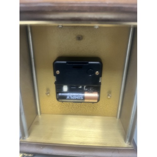 18 - Staiger Wood Cased Quartz Mantel Clock.
A brown wood-cased mantel clock featuring a Staiger quartz m... 
