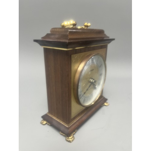 18 - Staiger Wood Cased Quartz Mantel Clock.
A brown wood-cased mantel clock featuring a Staiger quartz m... 