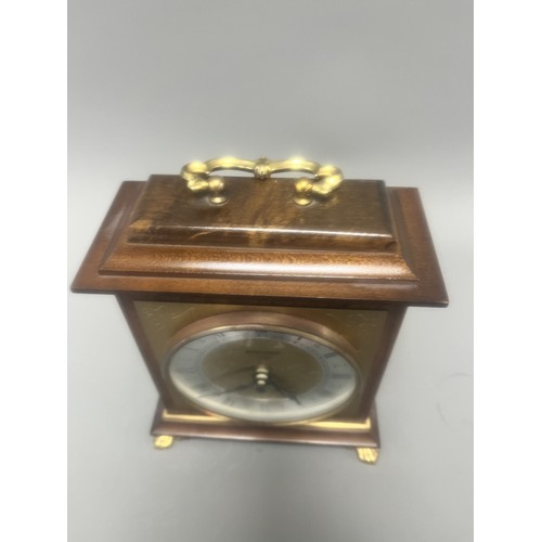 18 - Staiger Wood Cased Quartz Mantel Clock.
A brown wood-cased mantel clock featuring a Staiger quartz m... 