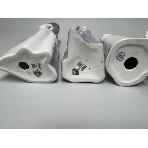 111 - A collection of four porcelain figurines including examples from Nao by Lladro, Miquel Requena, and ... 