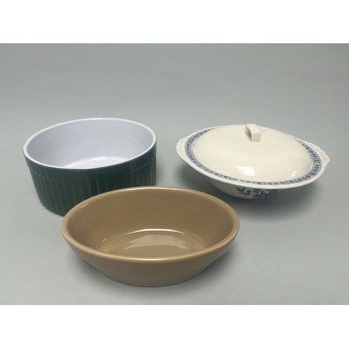 185 - A trio of domestic ceramic kitchen and tableware. The lot includes a deep circular ramekin or souffl... 