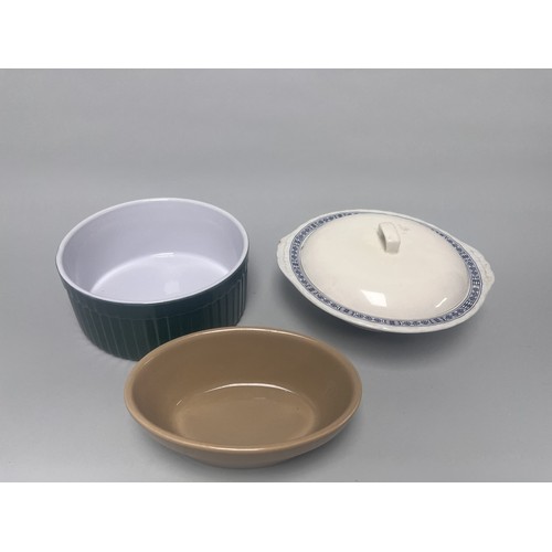 185 - A trio of domestic ceramic kitchen and tableware. The lot includes a deep circular ramekin or souffl... 