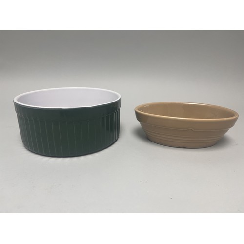 185 - A trio of domestic ceramic kitchen and tableware. The lot includes a deep circular ramekin or souffl... 