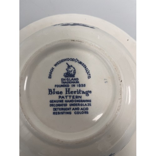 185 - A trio of domestic ceramic kitchen and tableware. The lot includes a deep circular ramekin or souffl... 