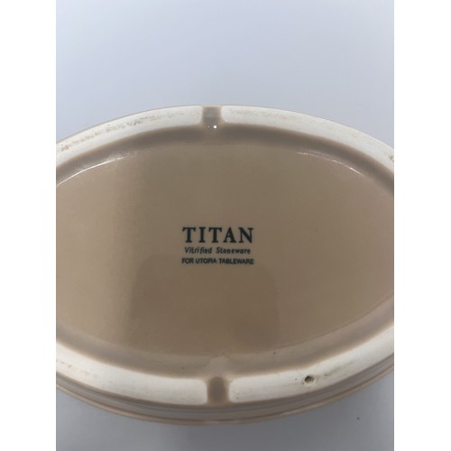 185 - A trio of domestic ceramic kitchen and tableware. The lot includes a deep circular ramekin or souffl... 