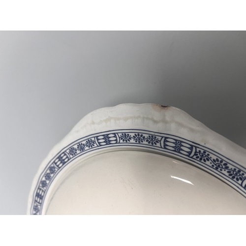 185 - A trio of domestic ceramic kitchen and tableware. The lot includes a deep circular ramekin or souffl... 