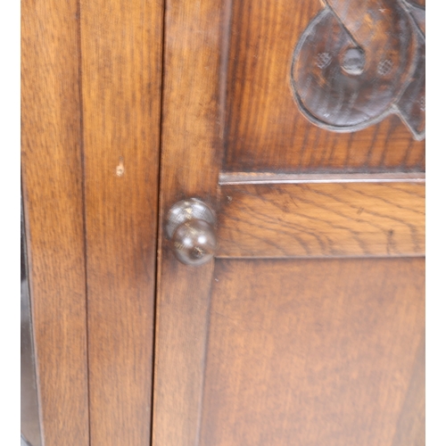 33 - A Bevan Funnell Reprodux Oak Four-Door Display Cabinet