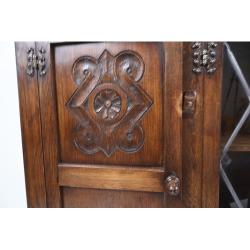 33 - A Bevan Funnell Reprodux Oak Four-Door Display Cabinet