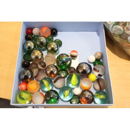 59 - Tray of marbles together with 3 bags of various stones/crystals/beads