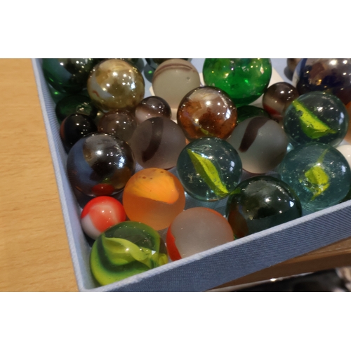 59 - Tray of marbles together with 3 bags of various stones/crystals/beads