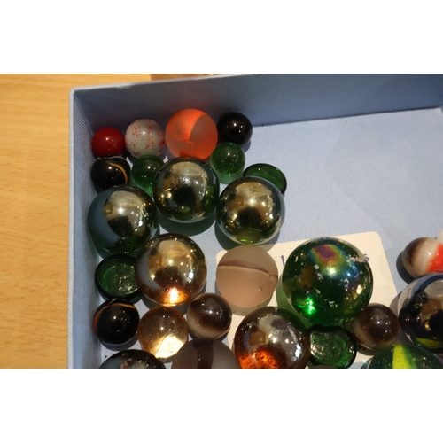 59 - Tray of marbles together with 3 bags of various stones/crystals/beads