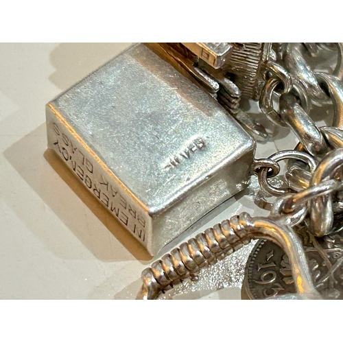 103 - Heavy Silver Charm Bracelet with some Fabulous Articulated and Hinged Charms