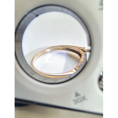 107 - 9ct Gold Garnet and Tapered Baguette Cut Diamond Ring - Fully hallmarked
